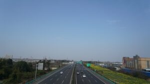 a highway with a few cars driving down it